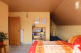 Schlafzimmer I - Schnuckeliges Einfamilienhaus mit kleinem pflegeleichten Grundstück und Garage, Bongard (5)